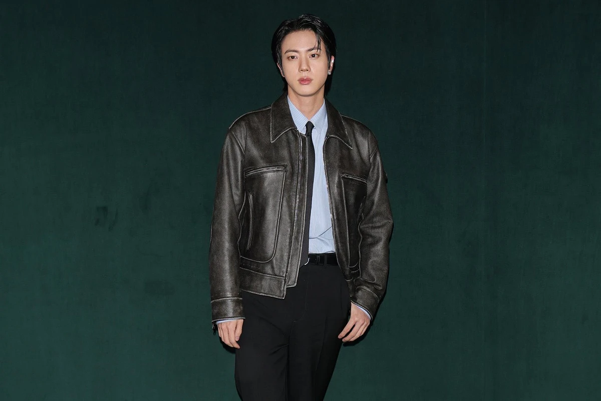 Jin of BTS Puts Edgy Spin on Workwear in Aviator Jacket and Tie at Gucci’s Fall 2025 London Fashion Show